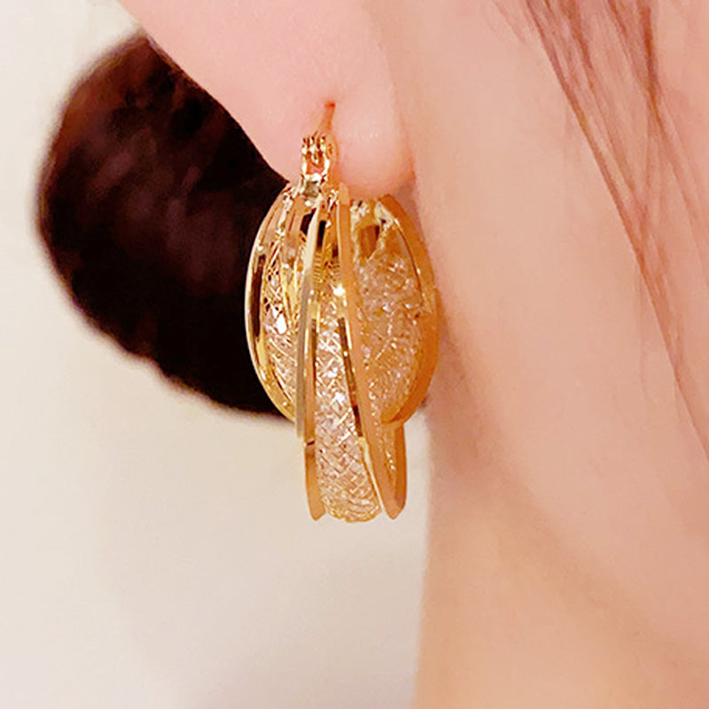 Boucles d'oreilles rondes vintage métalliques au style affirmé