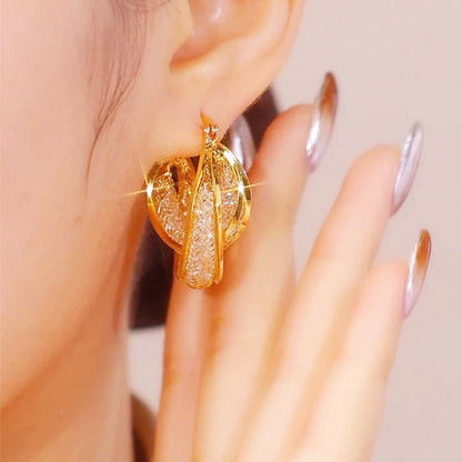 Boucles d'oreilles rondes vintage métalliques au style affirmé
