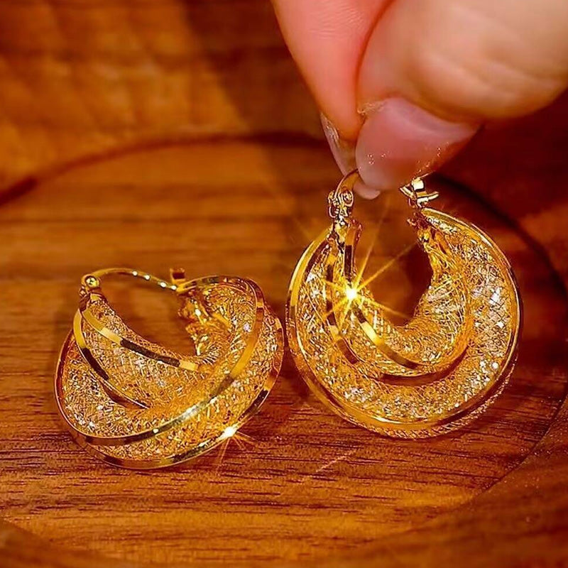 Boucles d'oreilles rondes vintage métalliques au style affirmé